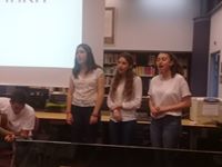 Image may contain: 3 people, people standing and indoor